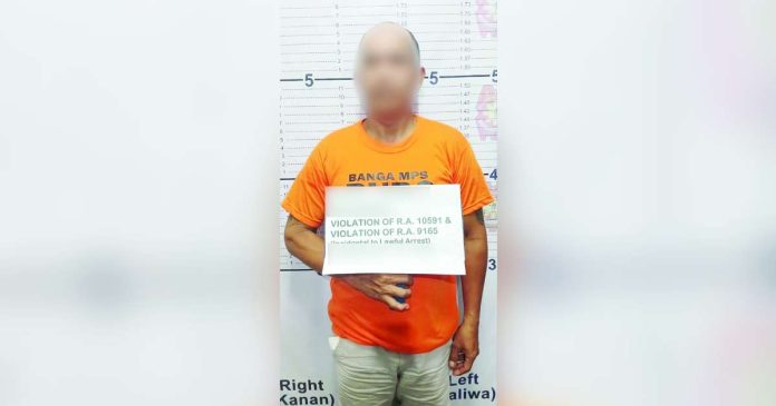 aklan arrest 1_superimposed Police nabbed this 42-year-old man and seized suspected shabu and a firearm during a raid on Feb. 19, 2025 in Barangay Daja Norte, Banga, Aklan. AKLAN PPO PHOTO