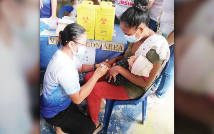 antique-immunization An infant receives a vaccine during the Department of Health’s “Big Catch-Up” immunization program at Barangay Supa Gymnasium in San Jose de Buenavista, Antique on Wednesday, Feb. 26, 2025. PNA PHOTO BY ANNABEL CONSUELO J. PETINGLAY