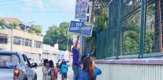 Personnel of the Commission on Elections (Comelec) in Bacolod City remove illegal campaign materials on Tuesday, Feb. 11, 2025, in Barangay Singcang-Airport.