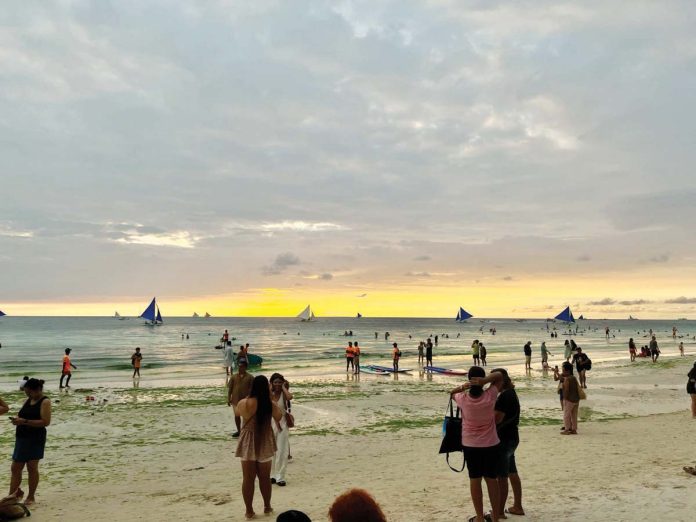 boracay_fees_1_resized Visitors to Boracay Island currently pay P150 each in terminal and environmental fees, plus an additional environmental fee upon departure, alongside boat fare costs. MAI LADIAO PHOTO