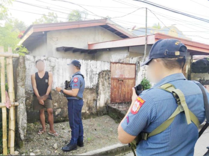 A 27-year-old man (left) wanted for three counts of rape was collared in Barangay Poblacion Ilaya, Dumarao, Capiz on Feb. 3, 2025. CAPIZ PPO PHOTO