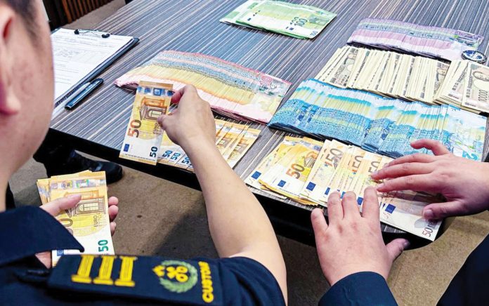 cash-smuggling The Bureau of Customs-Ninoy Aquino International Airport (BOC-NAIA) intercepted undeclared foreign currencies from a departing passenger at NAIA Terminal 1 on Feb. 21, 2025. The seized currency consisted of 3,950,000 Japanese Yen, 20,000 Euro, and 8,500 Kuwaiti Dinar. BOC PHOTO