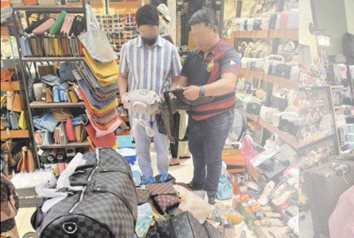 fake-goods More than half a billion pesos worth of counterfeit Louis Vuitton products were seized by the National Bureau of Investigation operatives in several shops in Mandaue City, Cebu. NBI PHOTO