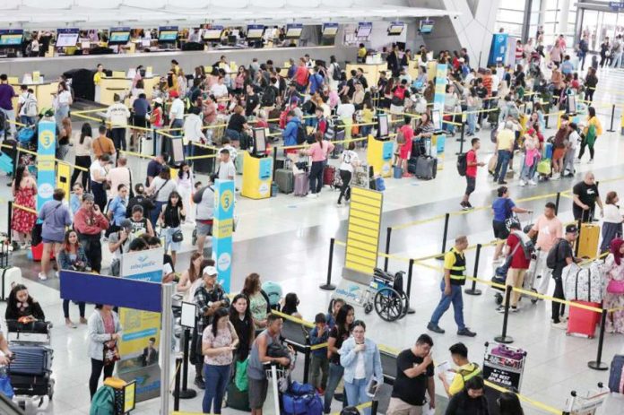 foreign_travel_resized Passengers catch their respective flights at Ninoy Aquino International Airport (NAIA) terminal 3. PLUS.INQUIRER.NET/GRIG C. MONTEGRANDE FILE PHOTO
