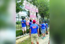 Commission on Elections personnel remove oversized campaign posters of re-electionist Sen. Imee Marcos during an “Operation Baklas” in Iloilo City. The campaign materials are found to violate posting regulations as part of efforts to ensure compliance with election laws ahead of the May 2025 elections.