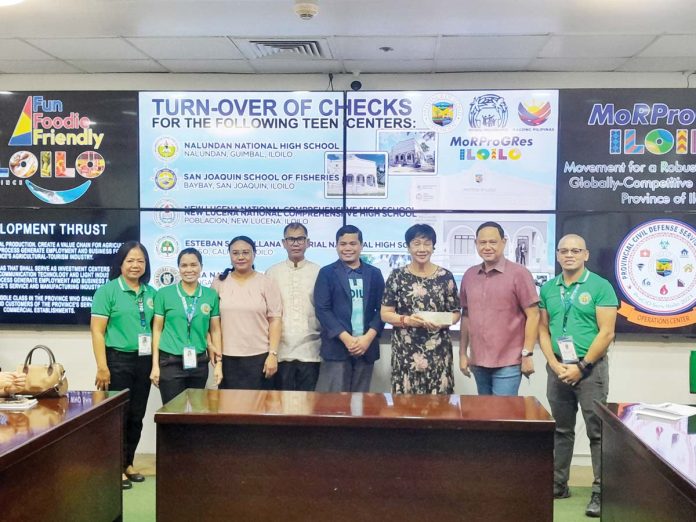 ime-turn-over-1-jpg Gov. Arthur Defensor Jr. of Iloilo and Provincial Population Office chief Atty. Ruel Von Superio hand over a P3.5-million check to Mina National High School for the construction of a teen center. The check was received by Mayor Lydia Grabato at the Iloilo Provincial Capitol on February 25. PHOTO FROM BALITA SA KAPITOLYO FACEBOOK PAGE