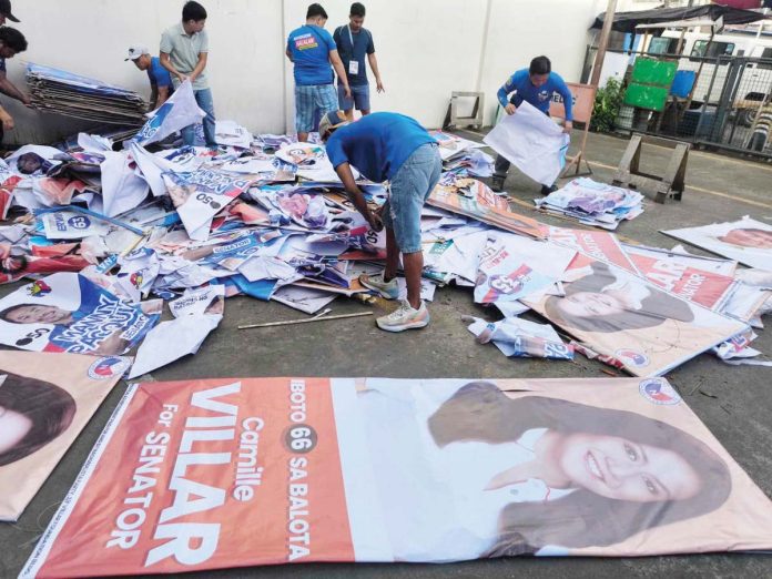 ime_unlawful_campaign Workers sort and remove campaign materials during the “Operation Baklas” on February 14, following the grand rally of Alyansa Para sa Bagong Pilipinas’ senatorial candidates in Iloilo City. PHOTO FROM COMELEC-ILOILO CITY FACEBOOK PAGE