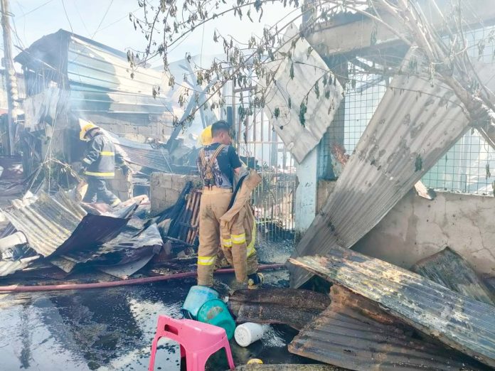 jaro-fire-1 Firefighters conduct a mopping-up operation after a fire hit the relocation site in Barangay Buntatala, Jaro, Iloilo City on Sunday, Feb. 16, 2025. AJ PALCULLO/PN