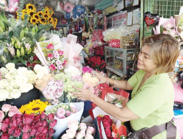 mai_flower1_(1)_resized “We’ve been receiving numerous reservations since a week ago, and some customers are even buying in advance,” says florist Margie who runs a flower shop at the Iloilo Central Market as she girds for a surge in flower demand this Valentine’s Day.