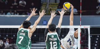 Negrense Leo Ordiales of National University Bulldogs scores against the defense of De La Salle University Green Spikers. UAAP PHOTO