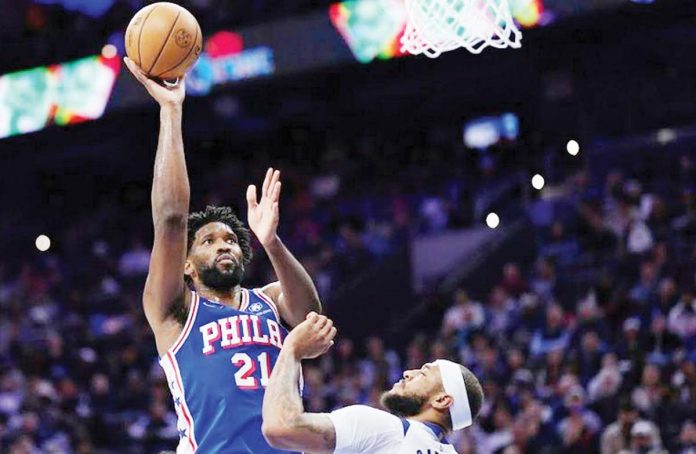 sports-Embiid Philadelphia 76ers’ Joel Embiid scores against the defense of Dallas Mavericks' Daniel Gafford. AFP PHOTO