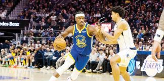 Golden State Warriors’ Jimmy Butler wards off the defense of Dallas Mavericks’ Max Christie. PHOTO COURTESY OF JOHN HEFTI/IMGN IMAGES