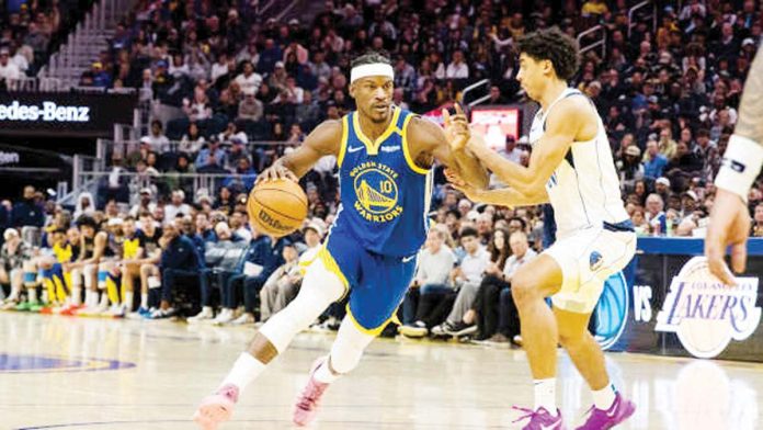 sports-NBA Golden State Warriors’ Jimmy Butler wards off the defense of Dallas Mavericks’ Max Christie. PHOTO COURTESY OF JOHN HEFTI/IMGN IMAGES