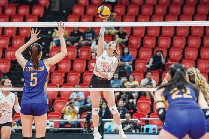 sports_Daquis_1_resized Rachel Anne Daquis of Farm Fresh Foxies drops the ball towards the Capital1 Solar Energy Solar Spikers’ defense. PVL PHOTO