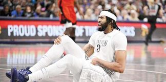 Dallas Mavericks’ Anthony Davis went down in the third quarter after experiencing tightness in his groin and quad area. JEROME MIRON//IMAGN IMAGES