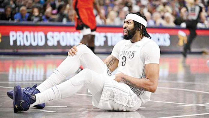 sports_Davis_1_resized Dallas Mavericks’ Anthony Davis went down in the third quarter after experiencing tightness in his groin and quad area. JEROME MIRON//IMAGN IMAGES