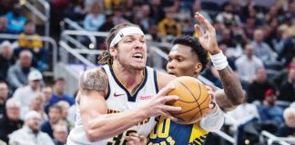 Denver Nuggets’ Aaron Gordon (32) holds on the ball while being defended by Indiana Pacers’ Bennedict Mathurin (00). Photo: TREVOR RUSZKOWSKI-IMAGN IMAGES