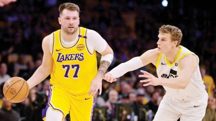 sports_Doncic_resized Los Angeles Lakers’ Luka Doncic dribbles the ball while being defended by Utah Jazz’s Lauri Markannen. PHOTO COURTESY OF USA TODAY