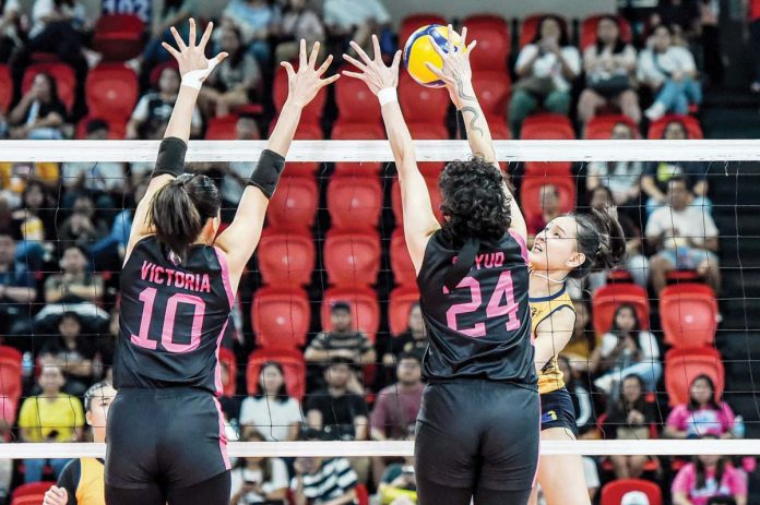 sports_Power_resized Capital1 Solar Energy Solar Spikers’ Leila Cruz had her shot blocked by the defense of Negrense Christine Joy Soyud of Akari Power Chargers. PVL PHOTO