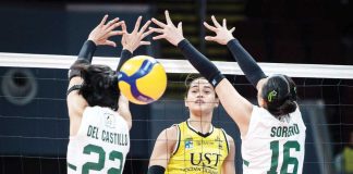 University of Santo Tomas Golden Tigresses’ Angeline Poyos hits the ball between the defense of De La Salle University Lady Spikers’ Lilay del Castillo and Babyjyne Soreno. UAAP PHOTO