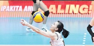 Negrense Cassie Carballo of University of Santo Tomas Golden Tigresses saves the ball. UAAP PHOTO