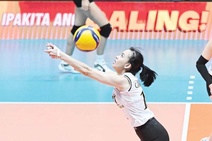 sports_UST_1_resized Negrense Cassie Carballo of University of Santo Tomas Golden Tigresses saves the ball. UAAP PHOTO