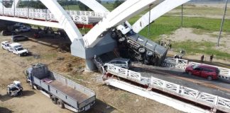 The third span of this 990-meter Cabagan-Santa Maria Bridge in Cabagan, Isabela, came crashing down, along with a dump truck whose content of quarried stones have been spilled all over the damaged section of the span. Four other vehicles also crossing the newly completed bridge at that time were damaged, injuring six people. VILLAMOR VISAYA JR., PHILIPPINE DAILY INQUIRER