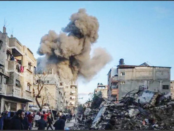 Gaza_1_resized Smoke billows upwards in front of a blue sky and grey buildings in the Gaza Strip after an Israeli airstrike. GETTY IMAGES