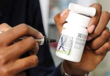 Nigeria and Kenya among nations running out of HIV drugs – WHO A staff member holds antiretroviral medication at TASO Mulago service center in Kampala, Uganda. GETTY IMAGES