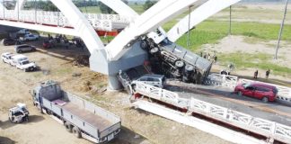 The third span of this 990-meter Cabagan-Santa Maria Bridge in Cabagan, Isabela, came crashing down, along with a dump truck, whose content of quarried stones have been spilled all over the damaged section of the span. Four other vehicles also crossing the newly completed bridge at that time were damaged, injuring six people. PHILIPPINE DAILY INQUIRER, VILLAMOR VISAYA JR.