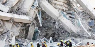 Rescue personnel walk near a building that collapsed in Bangkok, Thailand, on March 28, after a strong earthquake struck central Myanmar on the same day. REUTERS