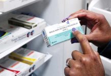 Measles highest in 25 years in Europe, WHO says A box containing the vaccine against measles, mumps and rubella, is being held by a woman with her right hand. REUTERS