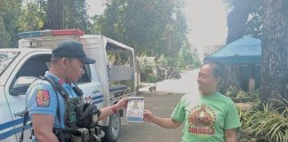 Dumalag police conduct community engagement thru dialogue and distribution of infographic materials related to the prohibited acts during election period, strict implementation of the Commission on Elections gun ban, and anti-illegal drugs campaign, among others in Barangay Poblacion, Dumalag, Capiz, on March 13, 2025. DUMALAG MUNICIPAL POLICE STATION PHOTO