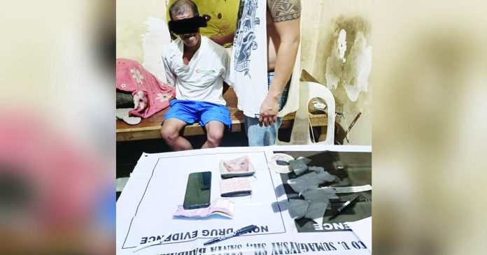 drug offender_superimposed Police apprehended alias “Redzon” after he handed over suspected shabu to a poseur buyer in an antidrug operation in Barangay Balabag, Pavia, Iloilo. DYRI RMN ILOILO PHOTO