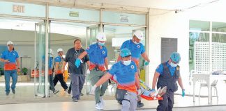 Rescue teams carry out an emergency evacuation during an earthquake drill at the Iloilo Provincial Capitol, testing the effectiveness of response operations. Photo by Dharlyn Mae Qubing, Intern, University of Antique