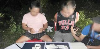 Plain-clothed police operatives conduct an inventory of the items recovered from a drug suspect in Mandurriao, Iloilo City. Authorities recovered 70 grams of shabu, worth P476,000. ICPO PHOTO