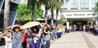 Iloilo Provincial Government employees and clients execute the “Duck, Cover, and Hold” technique during an earthquake drill, emphasizing the importance of preparedness in the event of a disaster. BALITA HALIN SA KAPITOLYO/FB PHOTO