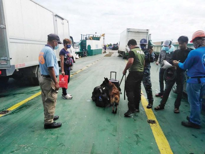 roro_1_resized Personnel of the Philippine Drug Enforcement Agency Region 6, Philippine Coast Guard and Dumangas K9 Unit conducted random paneling and K9 inspection operation at Dumangas Port in Barangay Sapao, Dumangas, Iloilo. PDEA-6 PHOTO