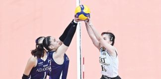 Negrense Cassie Carballo of the University of Santo Tomas Golden Tigresses and Jen Villegas of the Adamson University Lady Bulldogs joust for the ball on top of the net. UAAP PHOTO