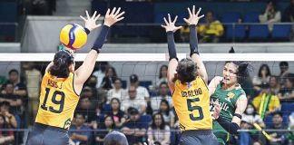 Negrense Angel Canino of De La Salle University Lady Spikers scores against the defense of Jean Asis of Far Eastern University Lady Tamaraws. UAAP PHOTO