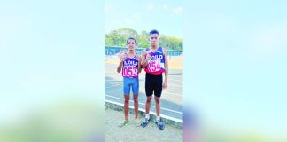 Efren Gempeson Jr. and Axel Mark Garcia clinched the gold and silver medals in the elementary boys 400-meter dash. PHOTO COURTESY OF RAY CABARLES