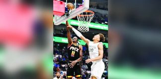 Phoenix Suns' Bol Bol (11) makes a basket past Dallas Mavericks' Kessler Edwards (20). PHOTO COURTESY OF JEROME MIRON/IMAGN IMAGES