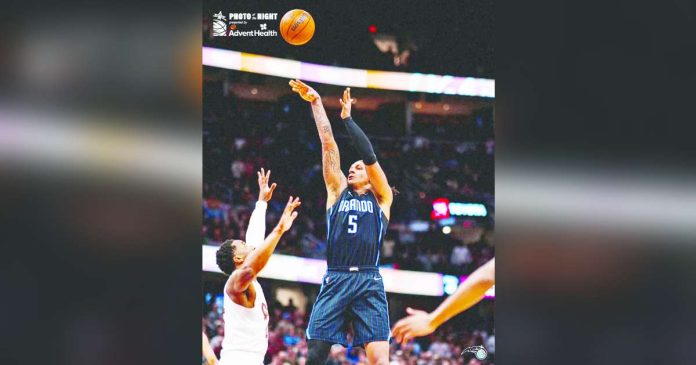 sports Orlando_superimposed Orlando Magic’s Paolo Banchero pulls up for a shot against the defense of Cleveland Cavaliers’ Donovan Mitchell. PHOTO COURTESY OF ORLANDO MAGIC