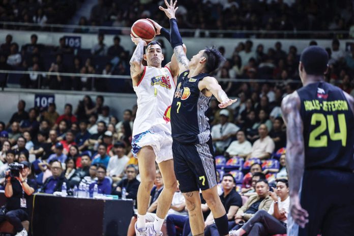 sports-PBA-1 Rain or Shine Elasto Painters’ Caelan Tiongson pulls up for a basket against the defense of TNT Tropang Giga’s John Paul Erram. PBA PHOTO