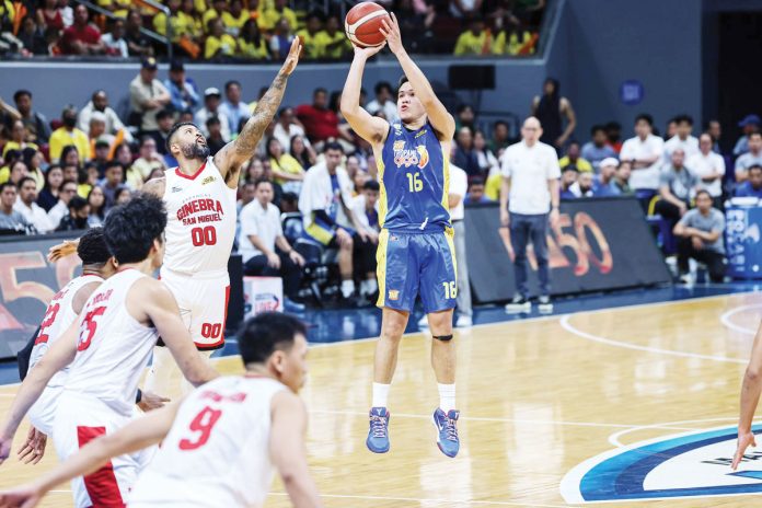 sports-PBA TNT Tropang Giga’s Roger Pogoy shoots over the defense of Barangay Ginebra San Miguel Kings’ Maverick Ahanmisi. PBA PHOTO