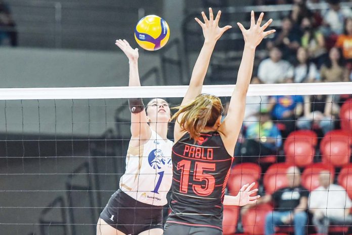 sports-Thunderbelles ZUS Coffee Thunderbelles’ Michelle Gamit scores against the defense of Petro Gazz Angels’ Myla Pablo. PVL PHOTO