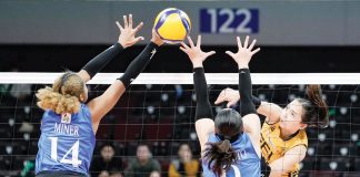 Far Eastern University Lady Tamaraws’ Gerzel Petallo hammers the ball towards the defense of Ateneo de Manila University Blue Eagles’ Alexa Miner and Takako Fujimoto. UAAP PHOTO