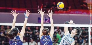 National University Lady Bulldogs’ Alyssa Solomon smashes the ball against the defense of Adamson University Lady Falcons. UAAP PHOTO