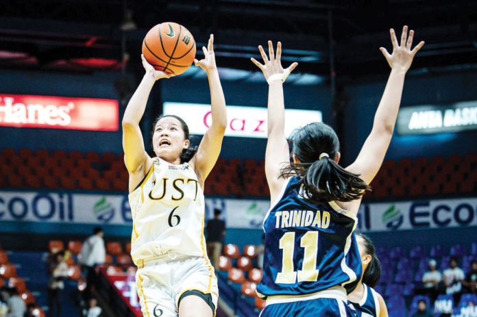 sports_Negrense_1_resized Negrense Barby Dajao of the University of Santo Tomas Junior Growling Tigresses goes for an inside hit. UAAP PHOTO