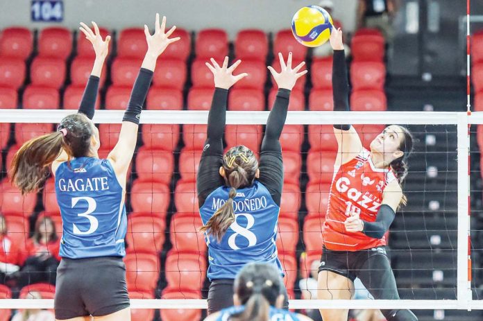 sports_PVL_resized Petro Gazz Angels’ Brooke Van Sickle tries to score against the defense of ZUS Coffee Thunderbelles’ Cloanne Mondonedo. PVL PHOTO